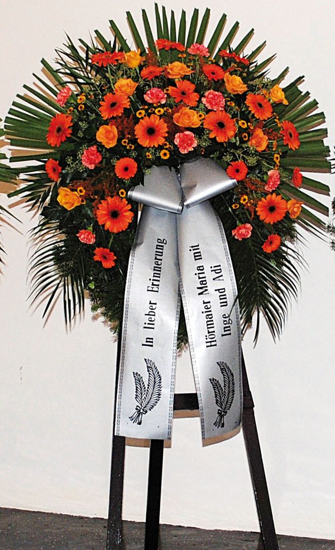 K 12 - orange Rosen, Nelken und Gerbera mit dunkler Mitte